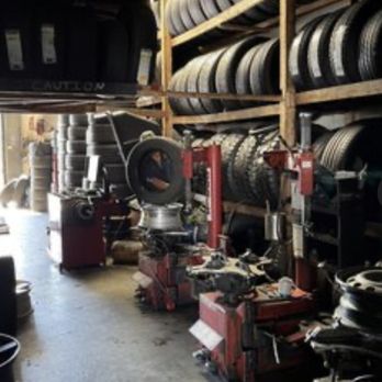 Tire racks and mounting equipment inside the shop bay